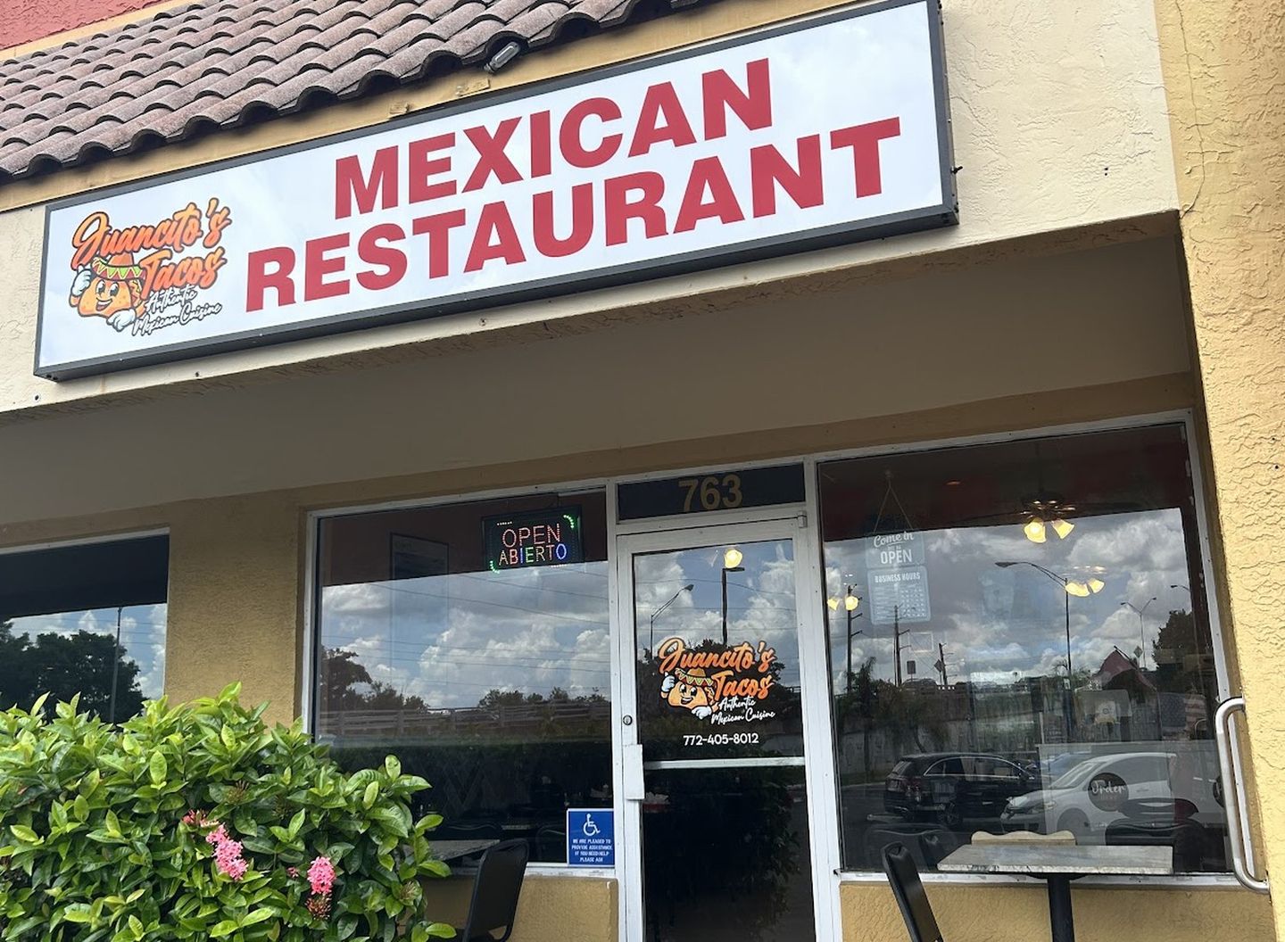 The Juancito's storefront — the 'Mexican Restaurant' sign under a tile roof on Federal Highway